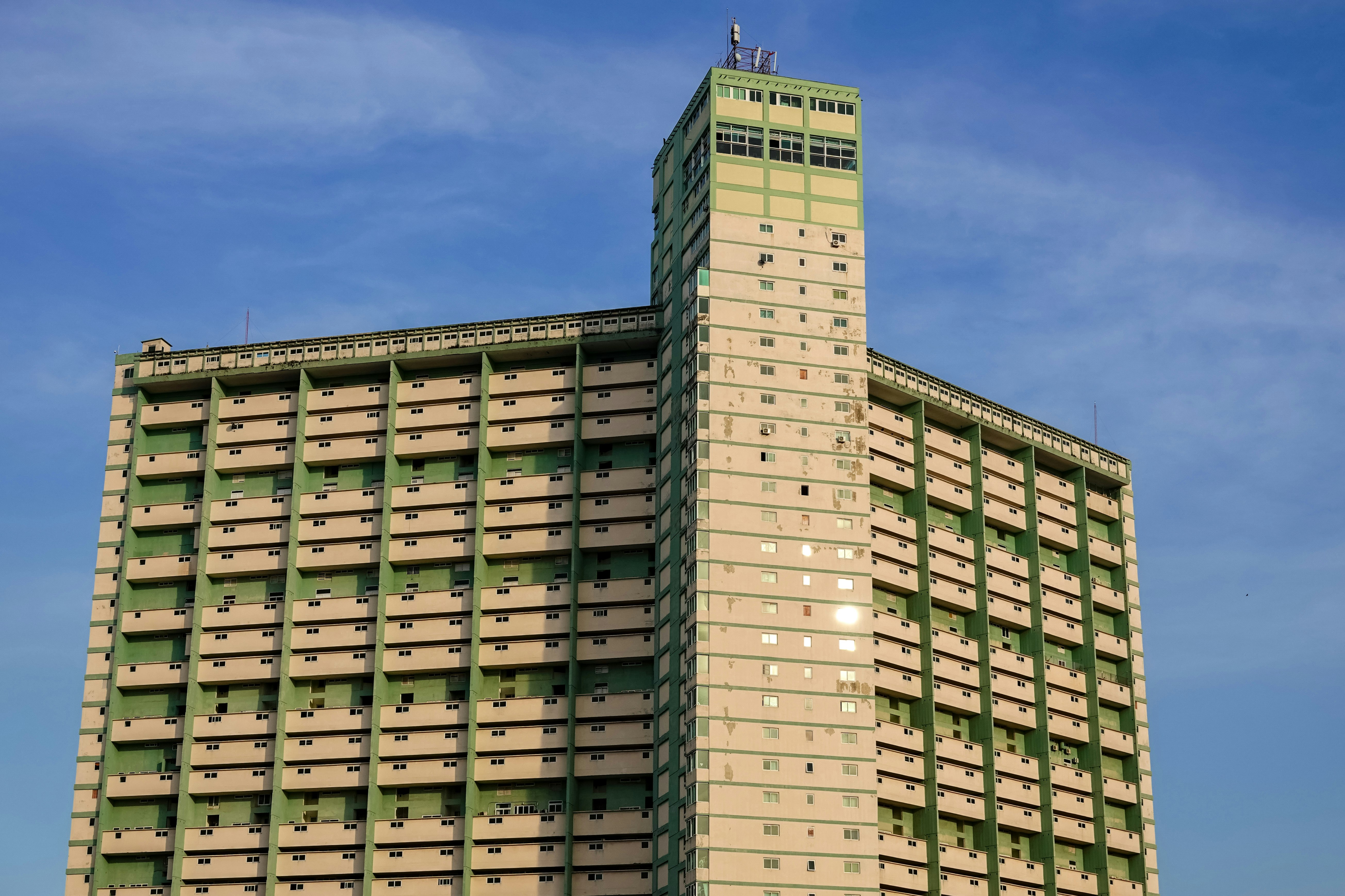 brown concrete building under blue sky during daytime